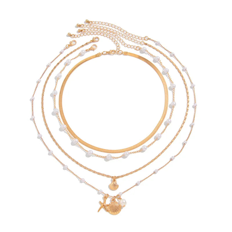 Collar en capas dorado con perlas